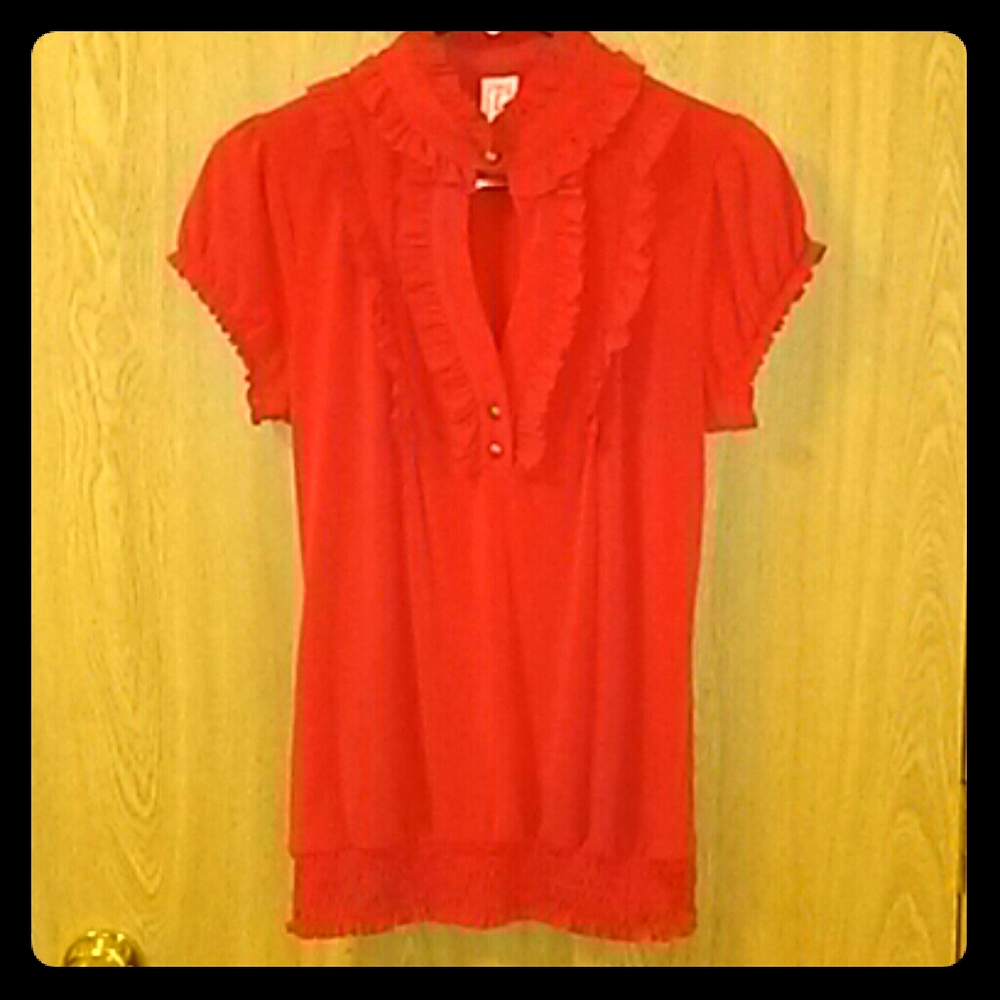 Red frilled blouse